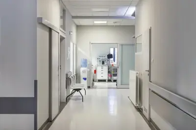 A corridor in a medical facility with a waiting area